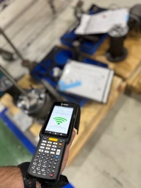 Xemelgo's locate app on a handheld reader scanning for orders